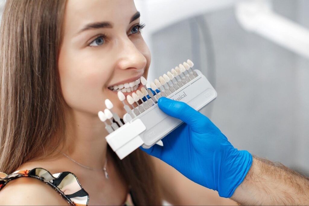 Patient checking in at a modern dental clinic reception desk