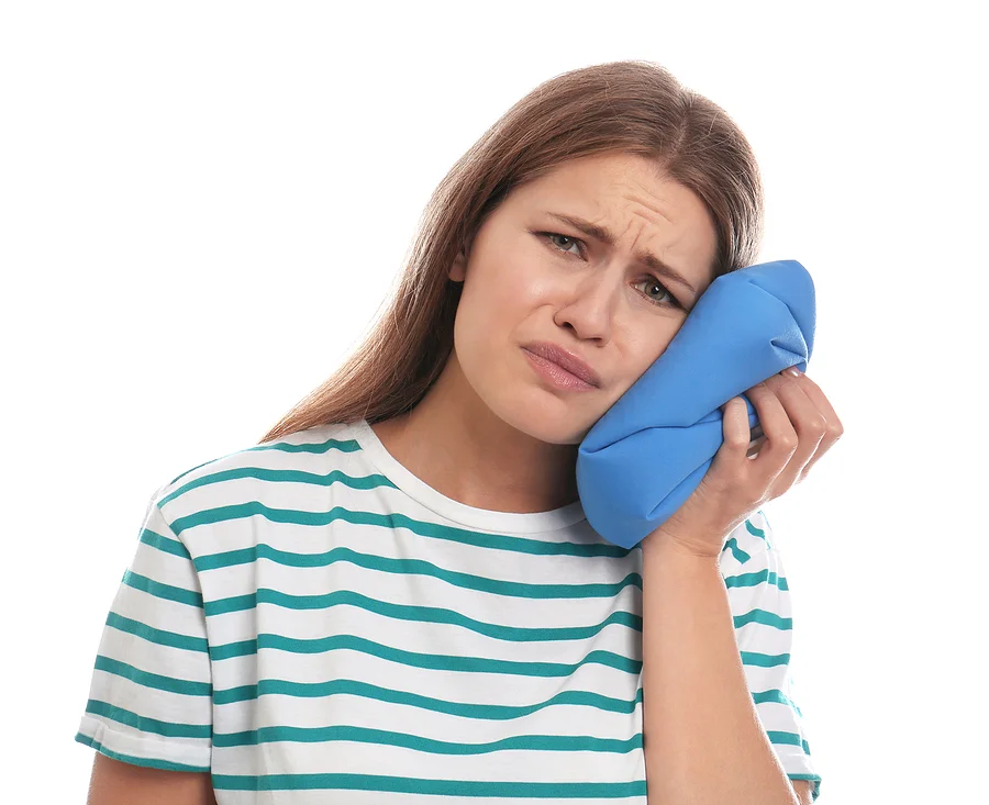 Young Woman Suffering From Toothache On White Background